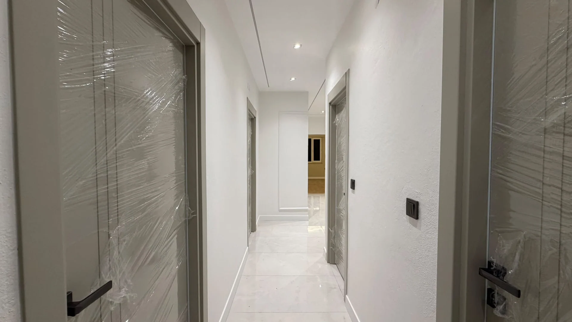 Hallway and doors connecting the rooms